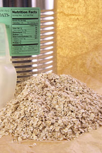 pile of oats next to a can